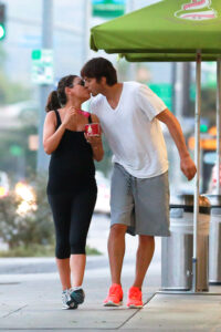 *EXCLUSIVE* Ashton and Mila feed her cravings with a Frozen Yogurt and a Kiss